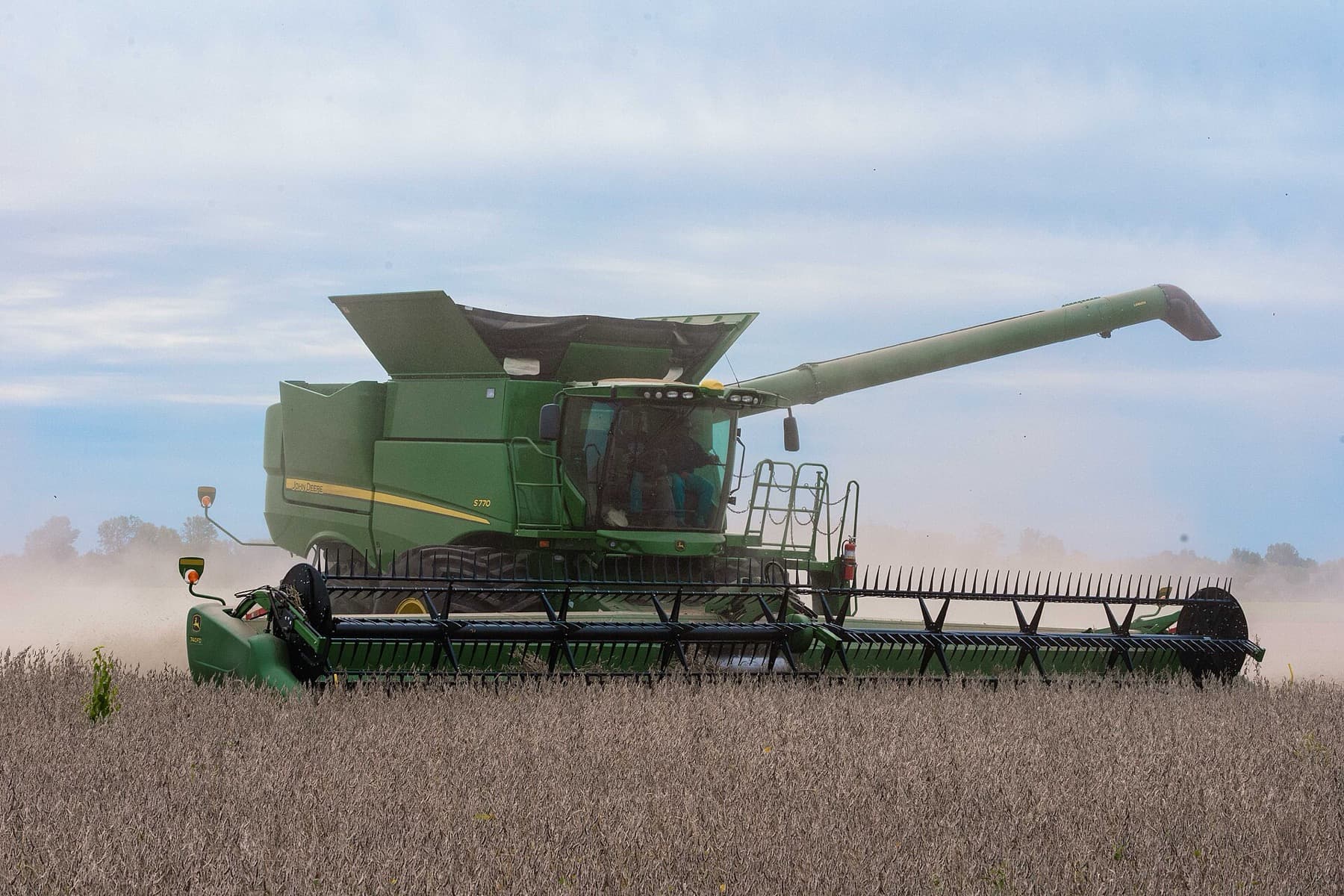 A combine harvesting soybeans